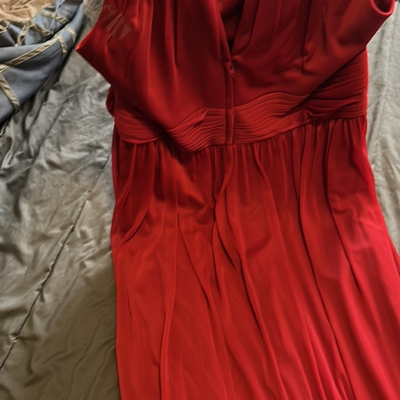 It’s the 2nd bridesmaid dress in candy apple red and it has a split on side - Picture 4 of 6